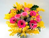 Bouquet with pink gerberas and mimosa.