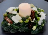 White centrepiece with candle.